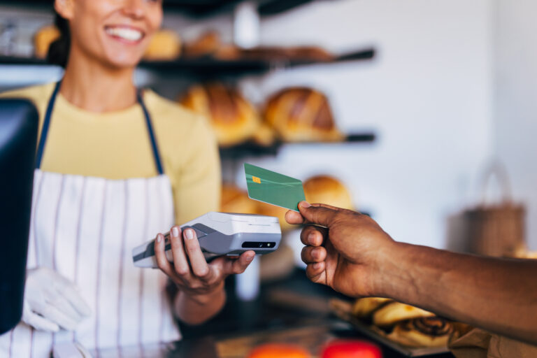 Customer Making Contactless Payment in a Bakery Shop