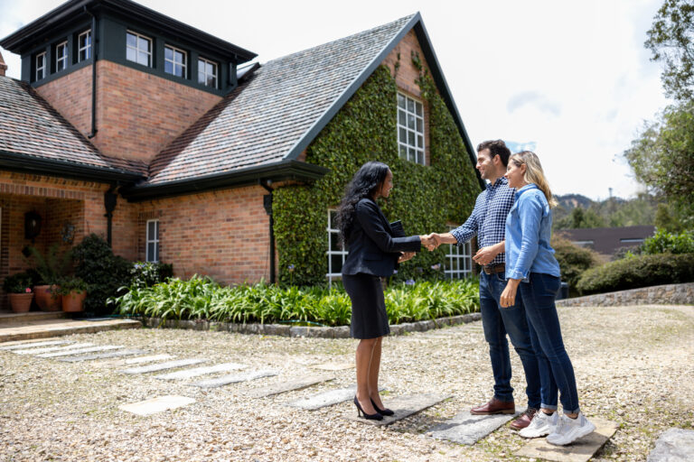 Real estate agent meeting a couple for a house showing