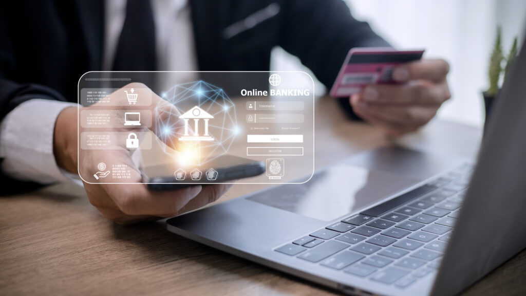 Online payment,Man’s hands holding smartphone and using credit card for online shopping.