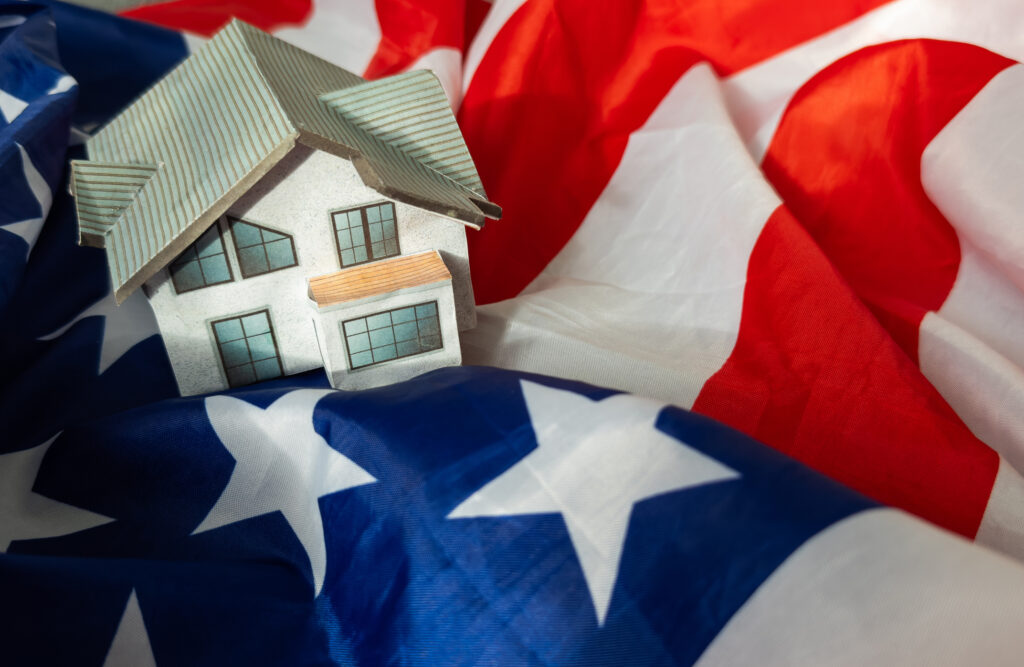 Small house on a flag – Living or migrating to United States of America
