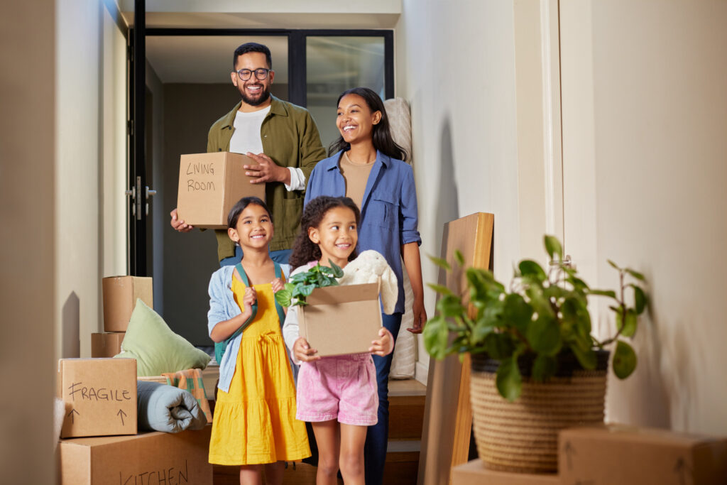 Multiethnic family with two children moving to new house
